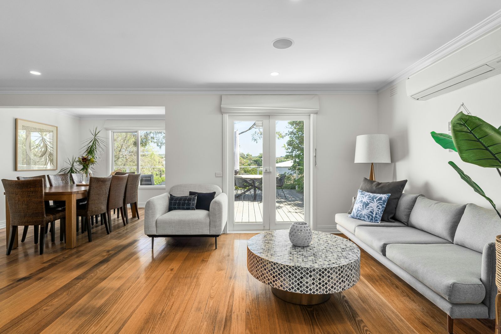 Sunlit living room with polished timber floors
