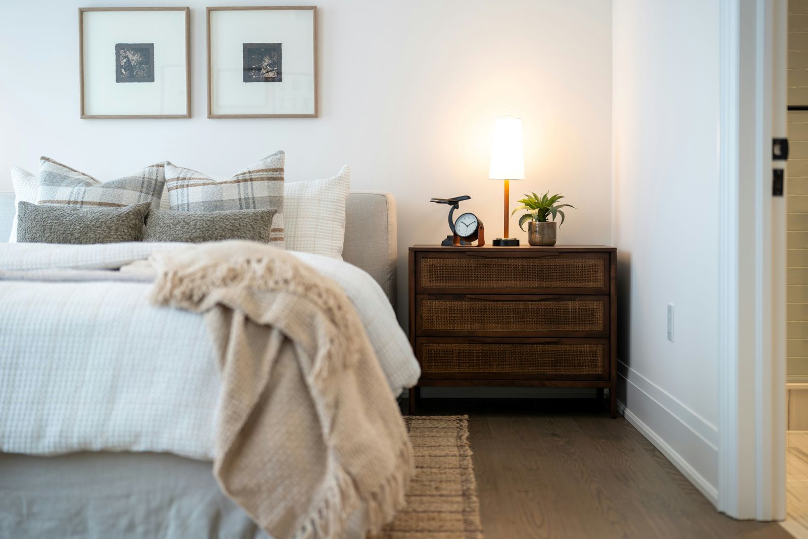 Neatly dressed bedroom in soft morning light